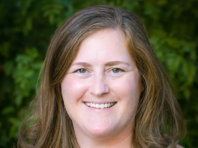 Portrait of female with a green background. 